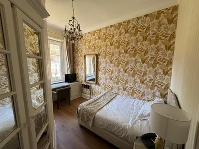 Un ou plusieurs lits dans un hébergement de l'établissement Hotel Restaurant Du Parc