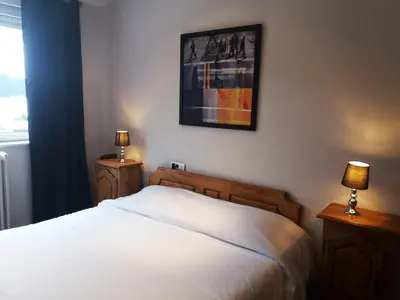 Un ou plusieurs lits dans un hébergement de l'établissement Hôtel De La Paix