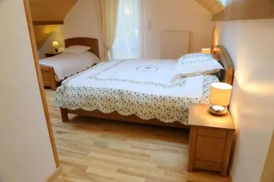 Un ou plusieurs lits dans un hébergement de l'établissement Gîte des Prés de la Douce