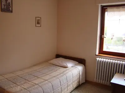 Un ou plusieurs lits dans un hébergement de l'établissement Hôtel Restaurant et Spa Au Tilleul
