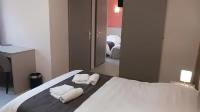 Un ou plusieurs lits dans un hébergement de l'établissement Hôtel du Ô des Bluches