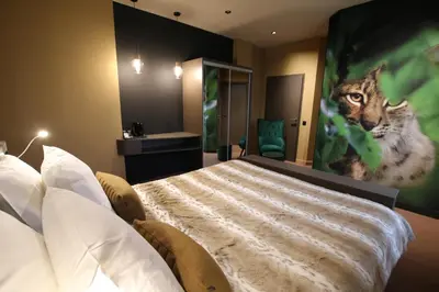 Un ou plusieurs lits dans un hébergement de l'établissement Les Loges Du Parc
