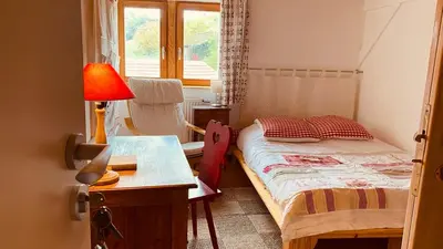 Un ou plusieurs lits dans un hébergement de l'établissement La maison des vignes