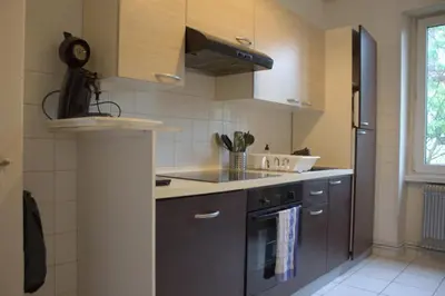 Cuisine ou kitchenette dans l'établissement Le MONTREAL F3 (2 chambres) Centre Ville/ GareTGV