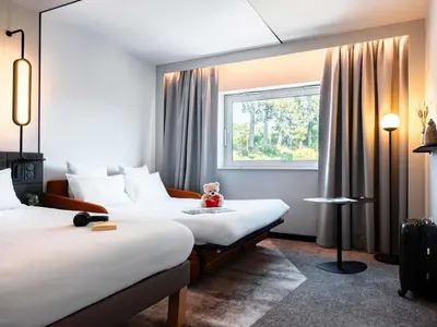 Un ou plusieurs lits dans un hébergement de l'établissement Novotel Belfort Centre Atria