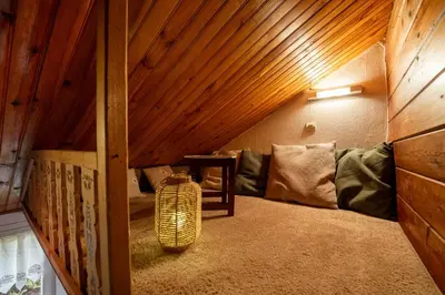 Coin salon dans l'établissement Au Chalet d'Aline - Atypique pour 4 personnes
