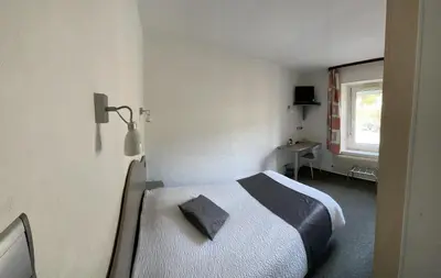 Un ou plusieurs lits dans un hébergement de l'établissement Hostel de La Grande Cascade