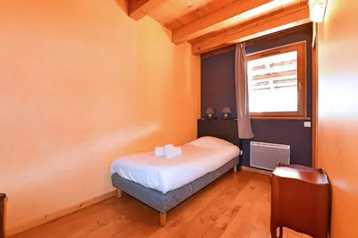 Un ou plusieurs lits dans un hébergement de l'établissement Pâquerettes - Maison avec Jardin et Parking
