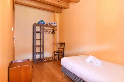Un ou plusieurs lits dans un hébergement de l'établissement Pâquerettes - Maison avec Jardin et Parking