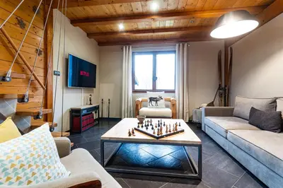 Télévision ou salle de divertissement dans l'établissement Chalet Les Myrtilles - Nature Randonnées Vélo