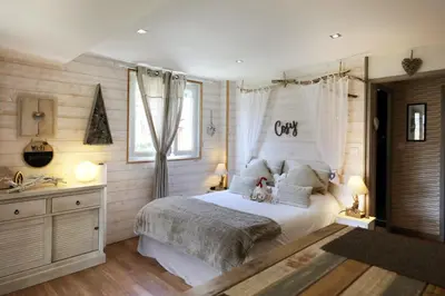 Un ou plusieurs lits dans un hébergement de l'établissement AU NID COSY D'ISA A GERARDMER VOSGES - Spas privatifs