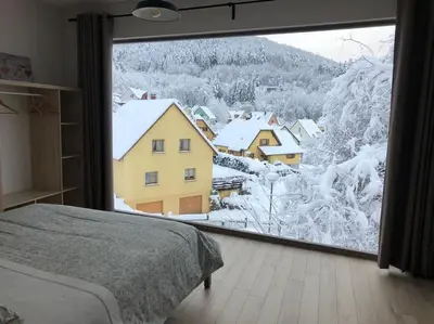 Un ou plusieurs lits dans un hébergement de l'établissement Gîte exceptionnel a Soultzbach les bains