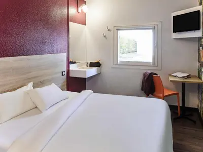 Un ou plusieurs lits dans un hébergement de l'établissement hotelF1 Mulhouse Bâle Aéroport