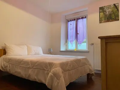 Un ou plusieurs lits dans un hébergement de l'établissement Le Chellois appartement La Bresse