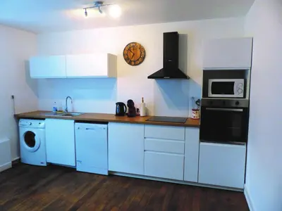 Cuisine ou kitchenette dans l'établissement Le Chellois appartement La Bresse