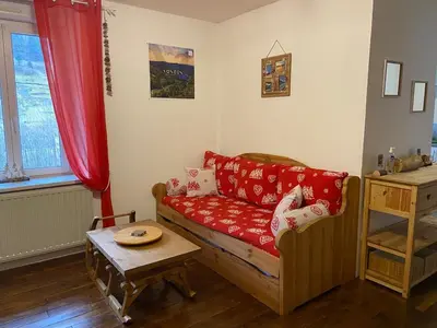 Coin salon dans l'établissement Le Chellois appartement La Bresse