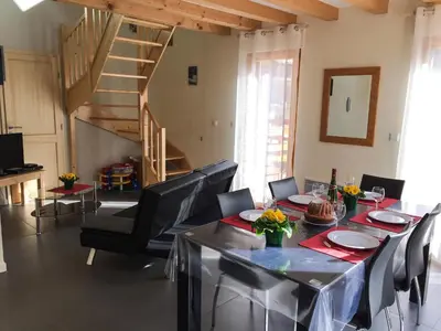 Coin salon dans l'établissement Le Chalet La Cigogne et Le Chamois