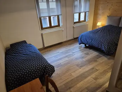 Un ou plusieurs lits dans un hébergement de l'établissement Chambres Thirion