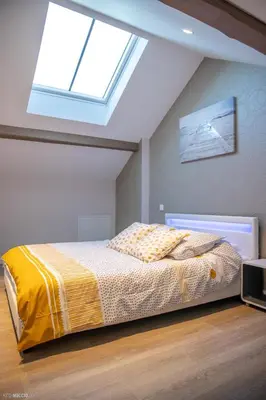 Un ou plusieurs lits dans un hébergement de l'établissement Modern Living