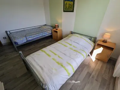 Un ou plusieurs lits dans un hébergement de l'établissement Gîte familial à Cornimont avec Wifi et parking - FR-1-589-84