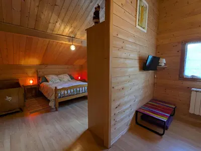 Un ou plusieurs lits dans un hébergement de l'établissement Chalet spacieux près de Gérardmer avec terrasse, verger et activités montagne - FR-1-589-121