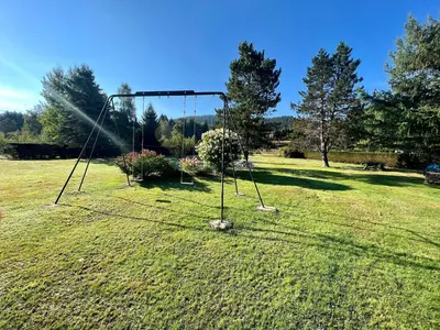 Jardin de l'établissement Gîte confortable à Gérardmer avec jardin, ski, randonnées et activités nautiques - FR-1-589-128