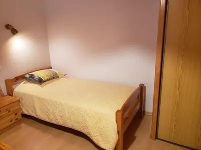 Un ou plusieurs lits dans un hébergement de l'établissement Maison de Montagne à La Bresse, 2 Chambres, Confort et Activités, Garage, Wifi Inclus - FR-1-589-152