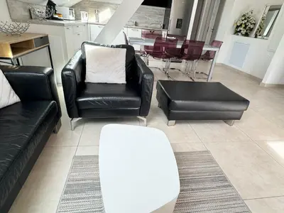 Coin salon dans l'établissement Appartement Bes,, Attique neuf avec confort
