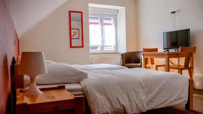 Un ou plusieurs lits dans un hébergement de l'établissement HOTEL RESTAURANT COLLIN