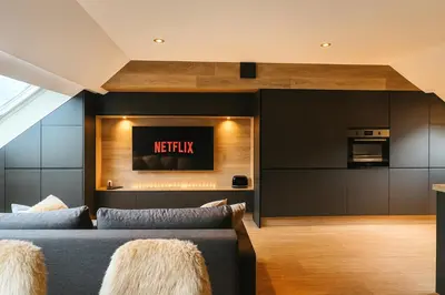 Télévision ou salle de divertissement dans l'établissement Ma Montagne Chic 2