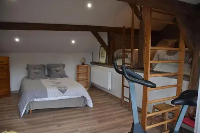 Un ou plusieurs lits dans un hébergement de l'établissement GITE DU BOIS DES HAUTS LES MILLE ETANGS