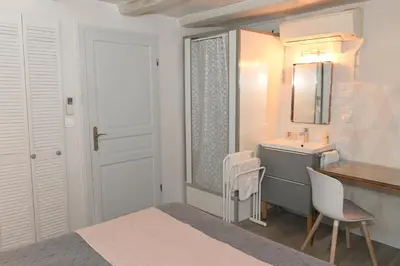Un ou plusieurs lits dans un hébergement de l'établissement Chambres d'hôtes Chez Caroline