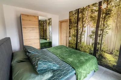 Un ou plusieurs lits dans un hébergement de l'établissement Les Balcons De La Haie Griselle gîte 4/pers