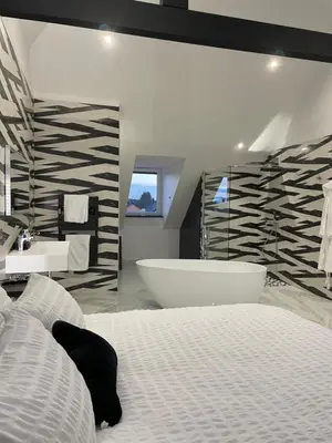 Un ou plusieurs lits dans un hébergement de l'établissement Les chambres d'à côté