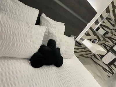 Un ou plusieurs lits dans un hébergement de l'établissement Les chambres d'à côté