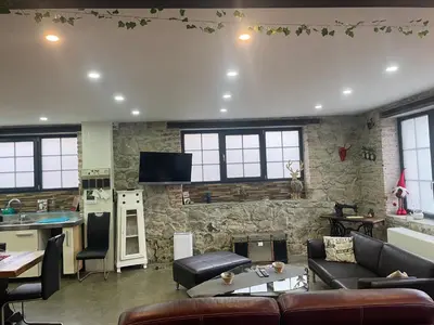 Télévision ou salle de divertissement dans l'établissement Le Loft de l ancienne forge
