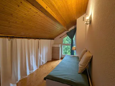 Un ou plusieurs lits dans un hébergement de l'établissement Chalet chaleureux à Gérardmer, vue pistes, 4 pers. - FR-1-589-371