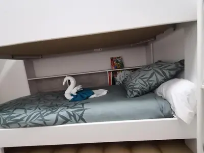 Un ou plusieurs lits dans un hébergement de l'établissement Villa kerangoues gîte 3 étoiles