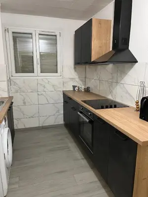Cuisine ou kitchenette dans l'établissement COSY F3 PROCHE CENTRE