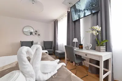 Un ou plusieurs lits dans un hébergement de l'établissement Chambres Vignes et Châteaux