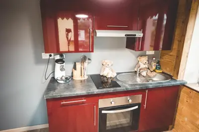 Cuisine ou kitchenette dans l'établissement le chale heureux
