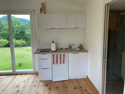Cuisine ou kitchenette dans l'établissement Le Chalet dans la Nature