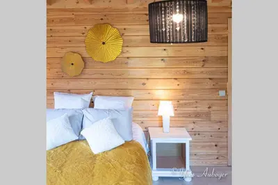 Un ou plusieurs lits dans un hébergement de l'établissement Chalet La Revoyotte