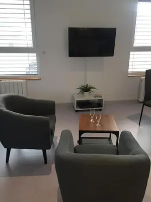 Télévision ou salle de divertissement dans l'établissement Le Nid des Coucous