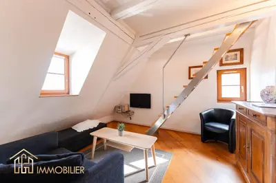 Télévision ou salle de divertissement dans l'établissement Au Bonheur des Anges Appartement duplex