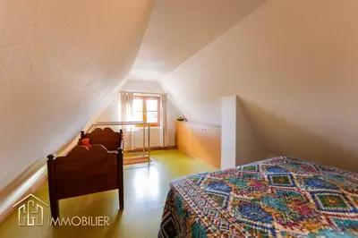 Un ou plusieurs lits dans un hébergement de l'établissement Au Bonheur des Anges Appartement duplex