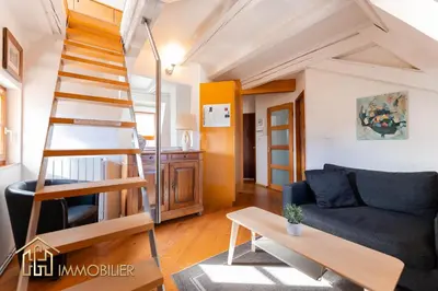 Coin salon dans l'établissement Au Bonheur des Anges Appartement duplex