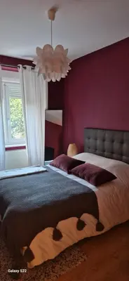 Un ou plusieurs lits dans un hébergement de l'établissement Cosy Appartement Complet centre-ville Montbéliard
