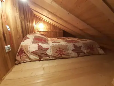 Un ou plusieurs lits dans un hébergement de l'établissement Esprit Myrtille Balcon Vue lac