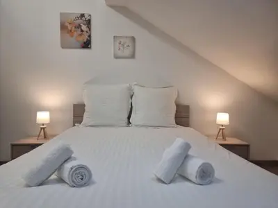 Un ou plusieurs lits dans un hébergement de l'établissement Le Ruisseau à Bussang Htes Vosges tout confort